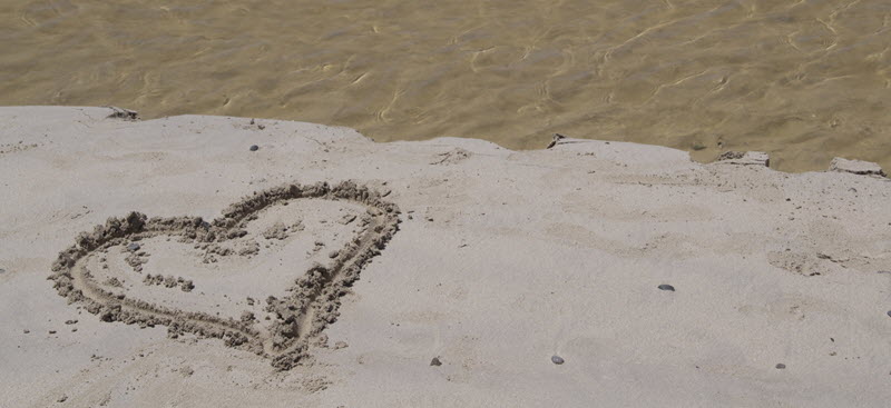 heart drawn into sand